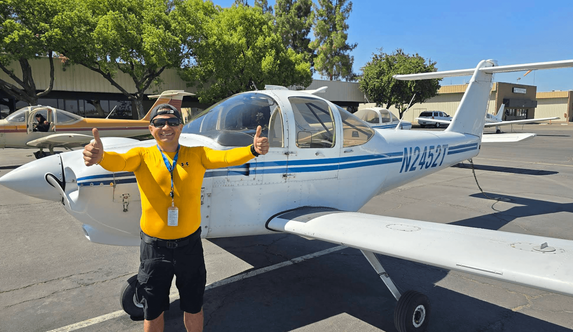 JB Aeronautics student celebrating after successful checkride on the ramp at KFAT