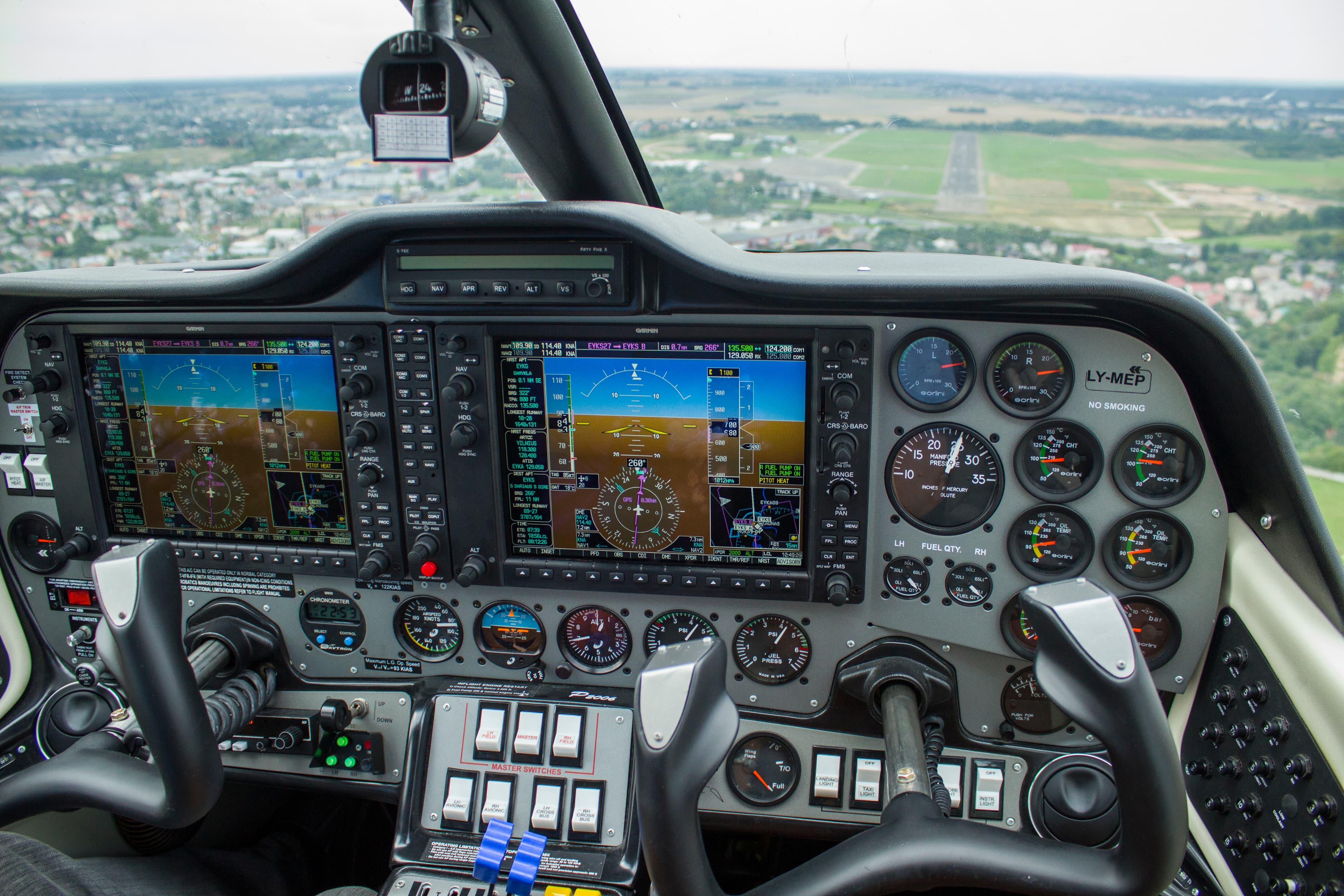 Aircraft cockpit view approaching runway